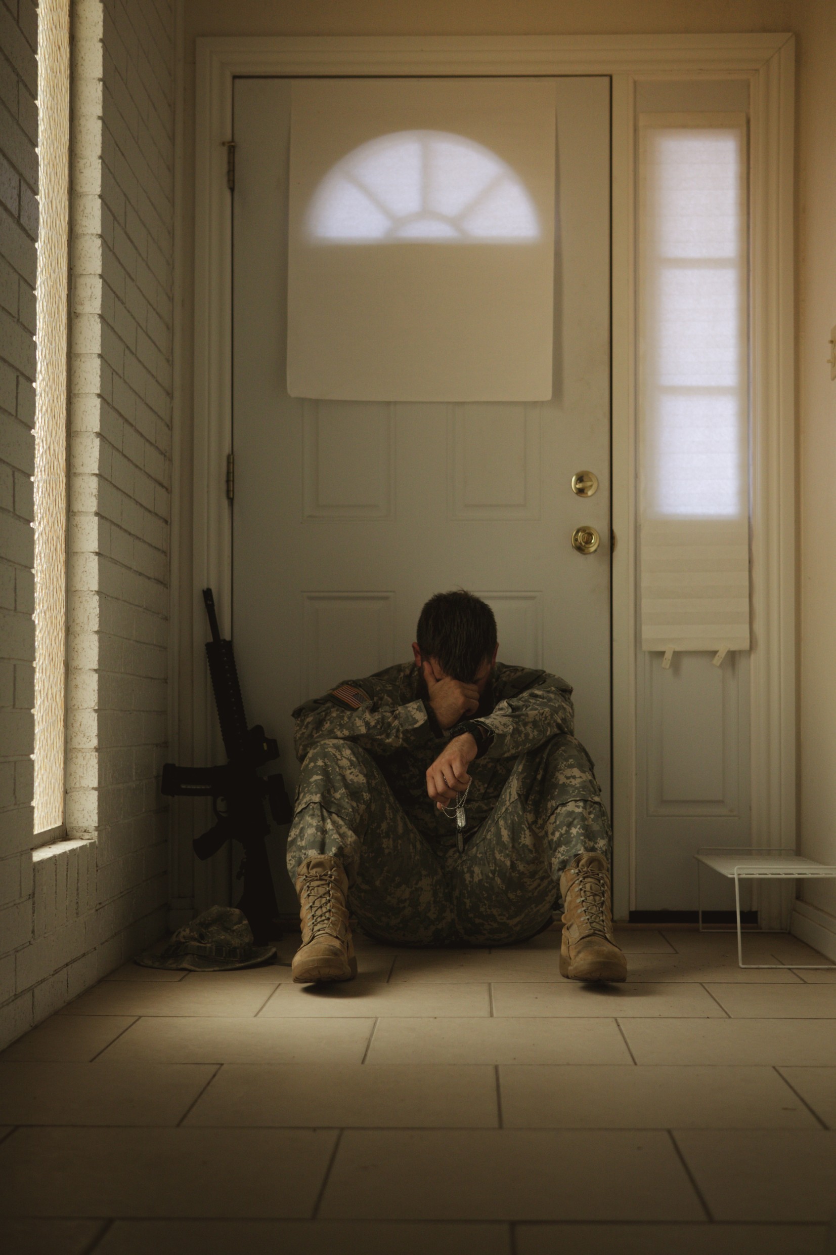 soldier in dark corner, depressed